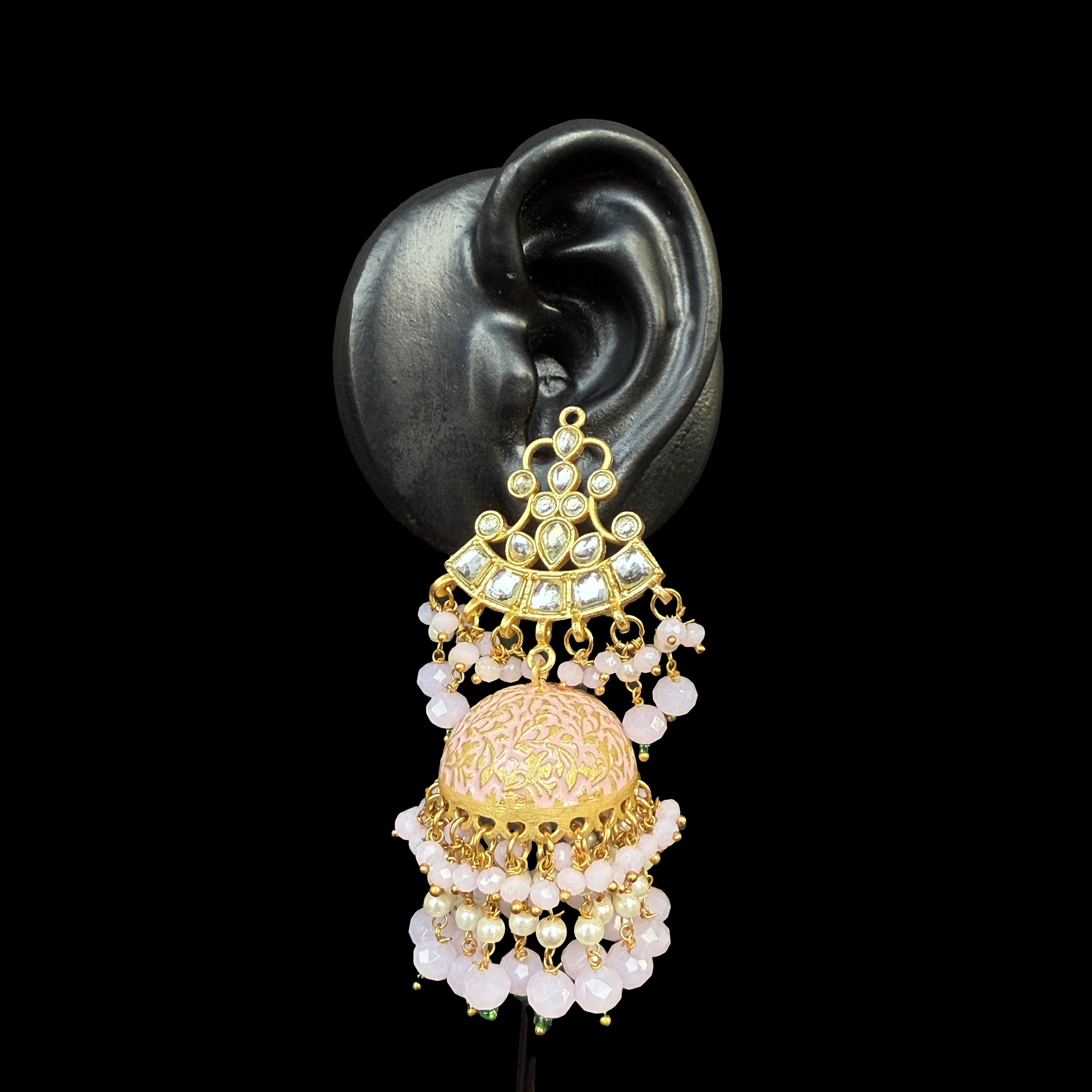 Experience timeless beauty with the Blush Rose Dome Jhumka Earrings, a perfect blend of tradition and artistry. Featuring an intricately engraved dome with soft pink embellishments and cascading pearl drops, these jhumkas radiate grace and charm.