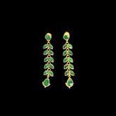 A stunning pair of cascading earrings featuring lush green emerald-like stones set in a delicate gold-tone vine design