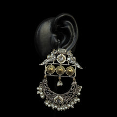 Adorn your ears with the majestic charm of the Imperial Pearl Crescent Earrings. Designed to blend timeless elegance with intricate craftsmanship, these earrings feature a crescent silhouette embellished with delicate pearls and shimmering stones.