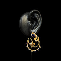 Embrace celestial beauty with the Midnight Blue Crescent Pearl Earrings. Designed in an enchanting crescent shape, these earrings showcase a blend of deep blue stones, delicate pearls, and shimmering accents, capturing the essence of moonlit elegance.