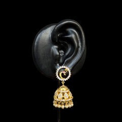 A celestial blend of moon and star motifs, these dazzling gold-plated jhumkas feature an intricate circular stud with a tiny ruby accent and a traditional jhumka adorned with pearls and stones.