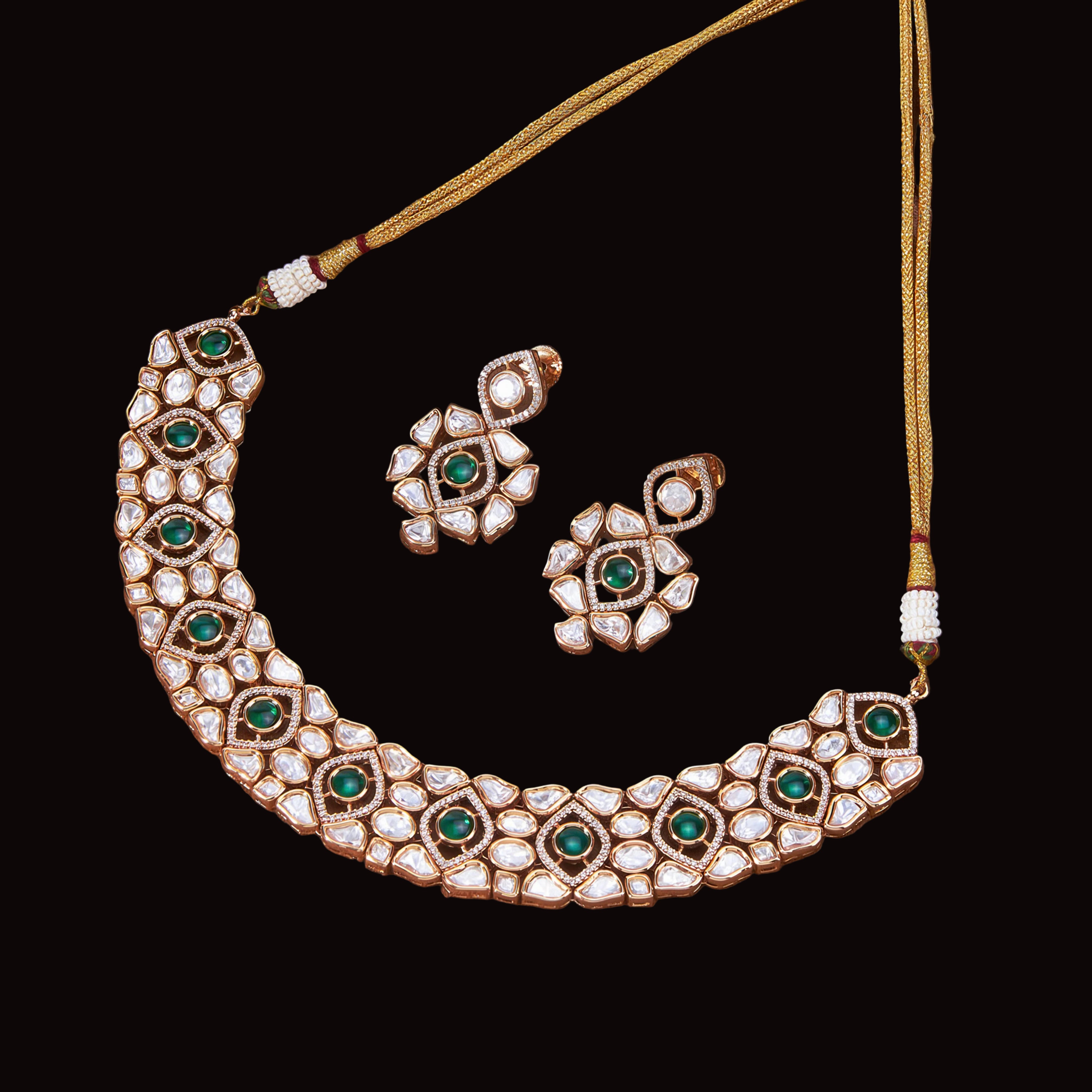 Jewelry set with necklace and earrings on a brown fabric background